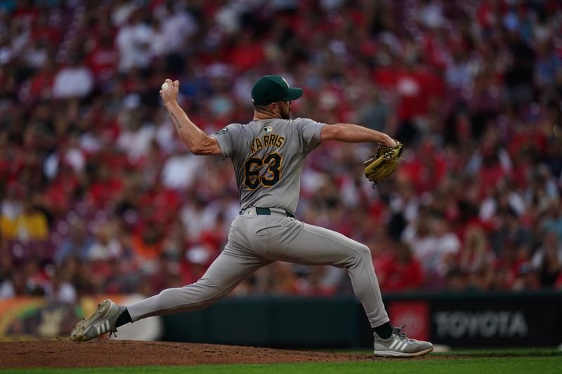 Aug 29, 2024; Cincinnati, Ohio, USA;  Oakland Athletics pitcher Hogan Harris (63) throws the ball during the seventh inning of the MLB game between the Cincinnati Reds and Oakland Athletics, Thursday, Aug. 29, 2024, at Cintas Center in Cincinnati. The Reds won 10-9. Mandatory Credit: Frank Bowen IV/The Cincinnati Enquirer-USA TODAY Sports