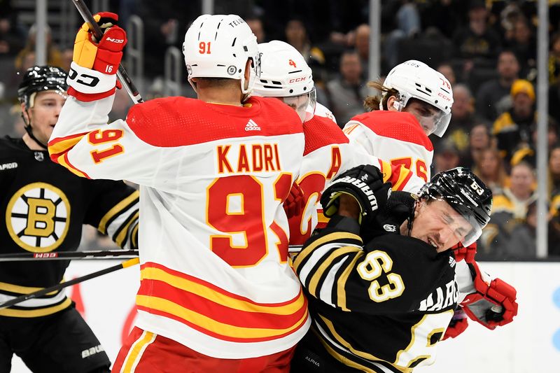 Feb 6, 2024; Boston, Massachusetts, USA; Boston Bruins left wing Brad Marchand (63) reacts after getting a cross check in the face by Calgary Flames center Martin Pospisil (76) during the first period at TD Garden. Mandatory Credit: Bob DeChiara-USA TODAY Sports