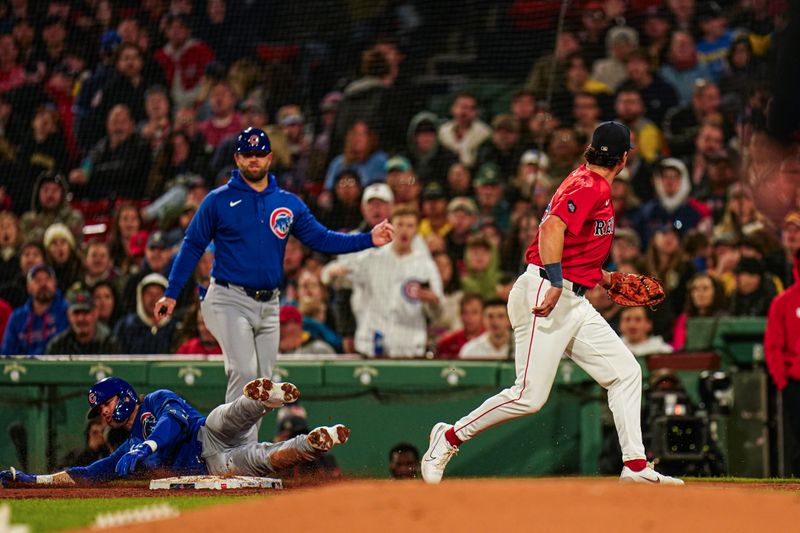 Apr 26, 2024; Boston, Massachusetts, USA; Boston Red Sox first baseman Bobby Dalbec (29) makes the out against Chicago Cubs second baseman Nico Hoerner (2) in the forth inning at Fenway Park. Mandatory Credit: David Butler II-USA TODAY Sports