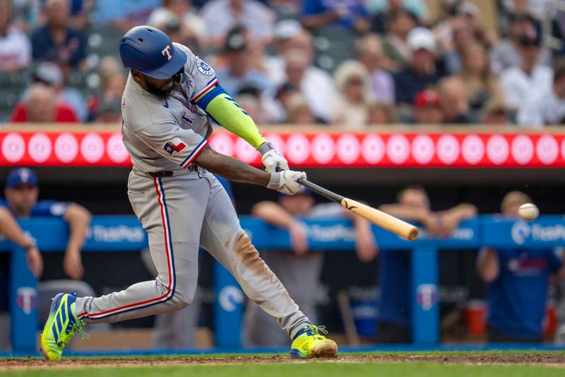 Jun 10, 2025; Minneapolis, Minnesota, USA; Texas Rangers right fielder Adolis Garcia (53 hits a double against the Minnesota Twins in the fifth inning at Target Field. Mandatory Credit: Jesse Johnson-Imagn Images