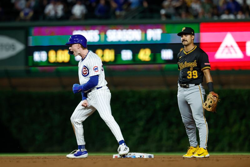 Sep 2, 2024; Chicago, Illinois, USA; Chicago Cubs outfielder Pete Crow-Armstrong (52) celebrates after stealing second base against Pittsburgh Pirates second baseman Nick Gonzales (39) during the fifth inning at Wrigley Field. Mandatory Credit: Kamil Krzaczynski-USA TODAY Sports