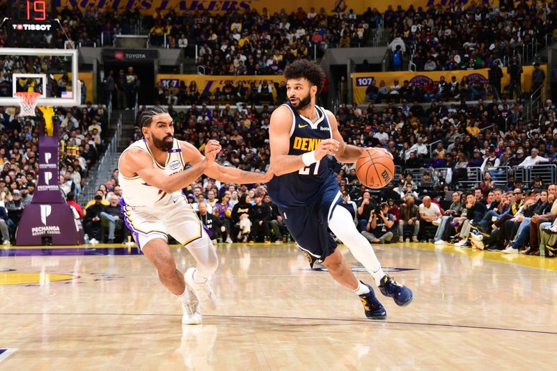 LOS ANGELES, CA - NOVEMBER 23: Jamal Murray #27 of the Denver Nuggets dribbles the ball during the game against the Los Angeles Lakers on November 23, 2024 at Crypto.Com Arena in Los Angeles, California. NOTE TO USER: User expressly acknowledges and agrees that, by downloading and/or using this Photograph, user is consenting to the terms and conditions of the Getty Images License Agreement. Mandatory Copyright Notice: Copyright 2024 NBAE (Photo by Adam Pantozzi/NBAE via Getty Images)