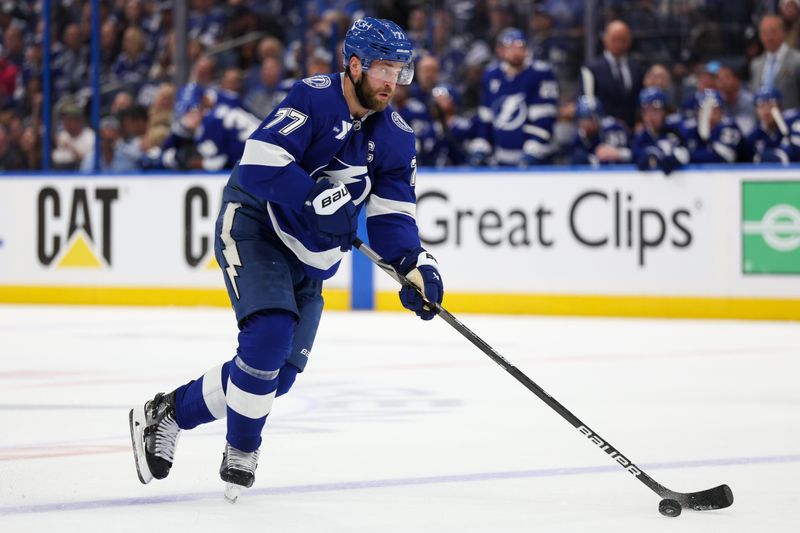 Apr 24, 2025; Tampa, Florida, USA; Tampa Bay Lightning defenseman Victor Hedman (77) controls the puck against the Florida Panthers during the first period in game two of the first round of the 2025 Stanley Cup Playoffs at Amalie Arena. Mandatory Credit: Nathan Ray Seebeck-Imagn Images