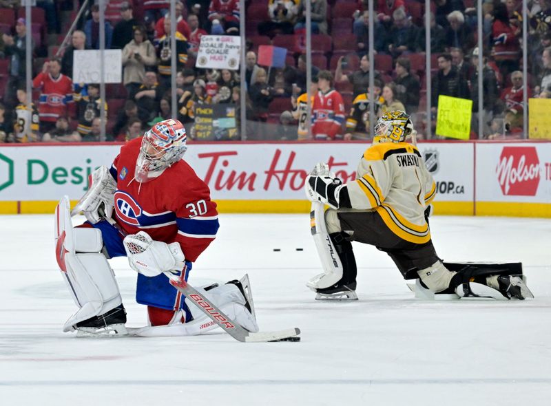 Mar 14, 2024; Montreal, Quebec, CAN; Montreal Canadiens goalie Cayden Primeau (30) and Boston Bruins goalie Jeremy Swayman (1) stretch during the warmup period at the Bell Centre. Mandatory Credit: Eric Bolte-USA TODAY Sports