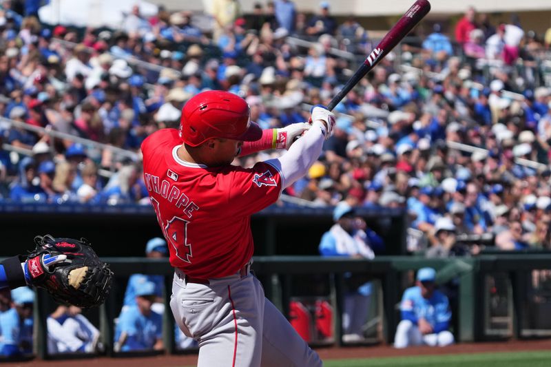 Mar 13, 2024; Surprise, Arizona, USA; Los Angeles Angels catcher Logan O’Hoppe (14) bats against the Kansas City Royals during the second inning at Surprise Stadium. Mandatory Credit: Joe Camporeale-USA TODAY Sports