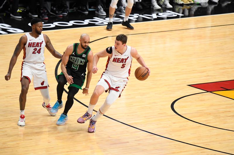 MIAMI, FL - APRIL 27: Nikola Jovic #5 of the Miami Heat dribbles the ball during the game against the Boston Celtics during Round 1 Game 3 of the 2024 NBA Playoffs on April 27, 2024 at Kaseya Center in Miami, Florida. NOTE TO USER: User expressly acknowledges and agrees that, by downloading and or using this Photograph, user is consenting to the terms and conditions of the Getty Images License Agreement. Mandatory Copyright Notice: Copyright 2024 NBAE (Photo by Brian Babineau/NBAE via Getty Images)