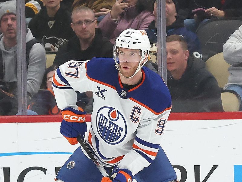 Dec 16, 2025; Pittsburgh, Pennsylvania, USA; Edmonton Oilers center Connor McDavid (97) handles the puck against the Pittsburgh Penguins during the first period at PPG Paints Arena. Mandatory Credit: Charles LeClaire-Imagn Images