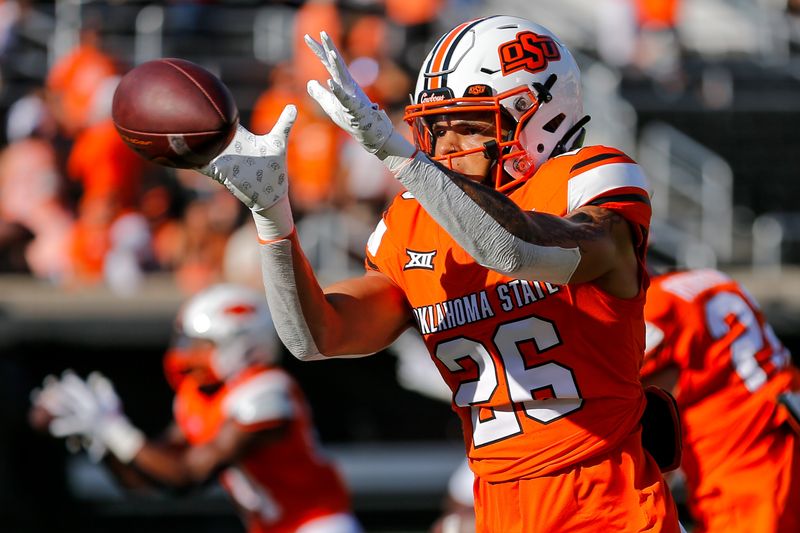 Sep 2, 2023; Stillwater, Oklahoma, USA; Oklahoma State's Jordan Reagan (26) warms up before an NCAA football game between Oklahoma State and Central Arkansas at Boone Pickens Stadium. Mandatory Credit: Nathan J. Fish-USA TODAY Sports