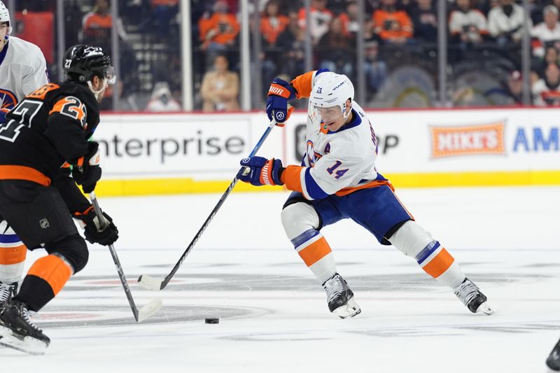 Apr 12, 2025; Philadelphia, Pennsylvania, USA; New York Islanders center Bo Horvat (14) controls the puck against the Philadelphia Flyers in the first period at Wells Fargo Center. Mandatory Credit: Kyle Ross-Imagn Images