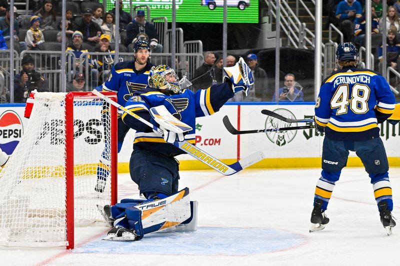 Nov 24, 2023; St. Louis, Missouri, USA;  St. Louis Blues goaltender Joel Hofer (30) makes a save against the Nashville Predators during the first period at Enterprise Center. Mandatory Credit: Jeff Curry-USA TODAY Sports