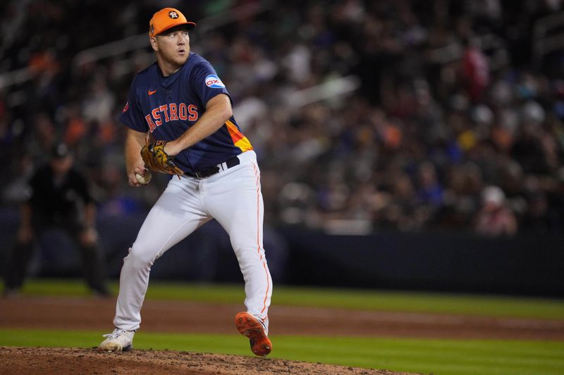 Mar 16, 2024; West Palm Beach, Florida, USA;  Houston Astros relief pitcher Ryan Gusto (98) pitches in the sixth inning against the New York Mets at CACTI Park of the Palm Beaches. Mandatory Credit: Jim Rassol-USA TODAY Sports