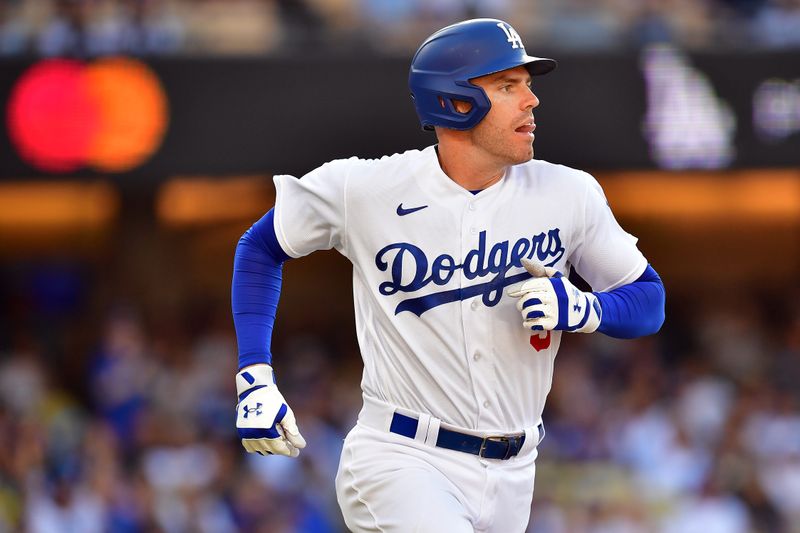 Jun 25, 2023; Los Angeles, California, USA; Los Angeles Dodgers first baseman Freddie Freeman (5) runs after hitting an RBI double against the Houston Astros during the eighth inning at Dodger Stadium. Mandatory Credit: Gary A. Vasquez-USA TODAY Sports