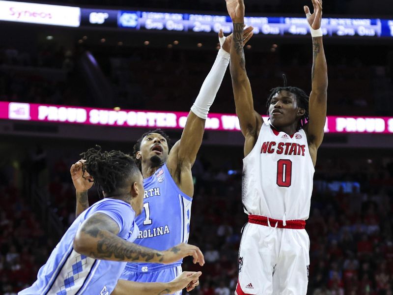 Feb 19, 2023; Raleigh, North Carolina, USA; North Carolina State Wolfpack guard Terquavion Smith (0) shoots a three point basket against North Carolina Tar Heels forward Leaky Black (1) during the first half of the game at PNC Arena. Mandatory Credit: Jaylynn Nash-USA TODAY Sports