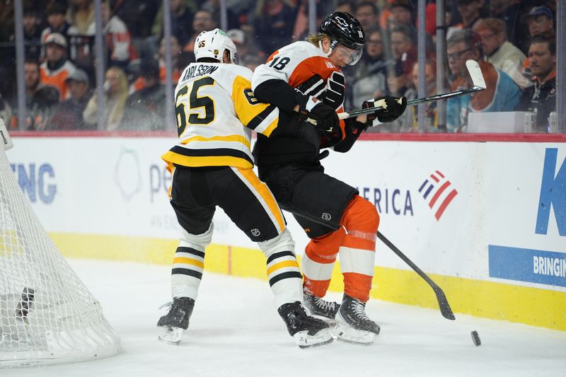 Oct 28, 2025; Philadelphia, Pennsylvania, USA; Pittsburgh Penguins defenseman Erik Karlsson (65) hits Philadelphia Flyers center Rodrigo Abols (18) in the first period at Xfinity Mobile Arena. Mandatory Credit: Kyle Ross-Imagn Images