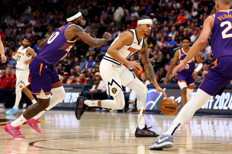 DENVER, COLORADO - OCTOBER 13: Michael Porter Jr. #1 of the Denver Nuggets drives to the basket against the Phoenix Suns at Ball Arena on October 13, 2024 in Denver, Colorado. NOTE TO USER: User expressly acknowledges and agrees that, by downloading and/or using this Photograph, user is consenting to the terms and conditions of the Getty Images License Agreement. (Photo by Jamie Schwaberow/Getty Images)