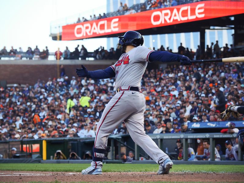 Aug 27, 2023; San Francisco, California, USA; Atlanta Braves catcher Travis d'Arnaud (16) hits a two-run RBI single against the San Francisco Giants during the fifth inning at Oracle Park. Mandatory Credit: Kelley L Cox-USA TODAY Sports