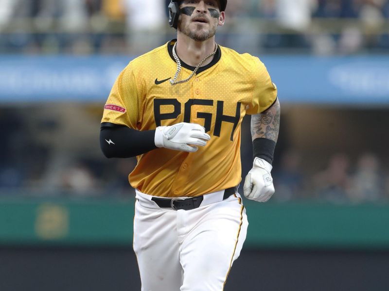 Aug 16, 2024; Pittsburgh, Pennsylvania, USA;  Pittsburgh Pirates catcher Yasmani Grandal (6) circles the bases on a solo home run against the Seattle Mariners during the fifth inning at PNC Park. Mandatory Credit: Charles LeClaire-USA TODAY Sports