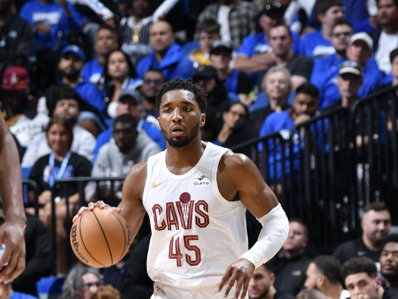 ORLANDO, FL - APRIL 25: Donovan Mitchell #45 of the Cleveland Cavaliers handles the ball during the game  against the Orlando Magic during Round 1 Game 3 of the 2024 NBA Playoffs on April 25, 2024 at Kia Center in Orlando, Florida. NOTE TO USER: User expressly acknowledges and agrees that, by downloading and or using this photograph, User is consenting to the terms and conditions of the Getty Images License Agreement. Mandatory Copyright Notice: Copyright 2023 NBAE (Photo by Fernando Medina/NBAE via Getty Images)