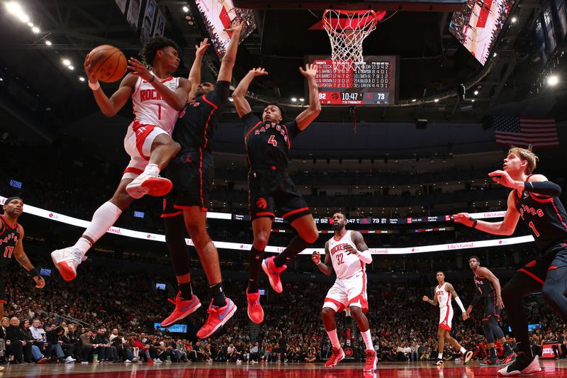 TORONTO, CANADA - FEBRUARY 9: Amen Thompson #1 of the Houston Rockets looks to pass the ball during the game against the Toronto Raptors on February 9, 2024 at the Scotiabank Arena in Toronto, Ontario, Canada.  NOTE TO USER: User expressly acknowledges and agrees that, by downloading and or using this Photograph, user is consenting to the terms and conditions of the Getty Images License Agreement.  Mandatory Copyright Notice: Copyright 2024 NBAE (Photo by Vaughn Ridley/NBAE via Getty Images)