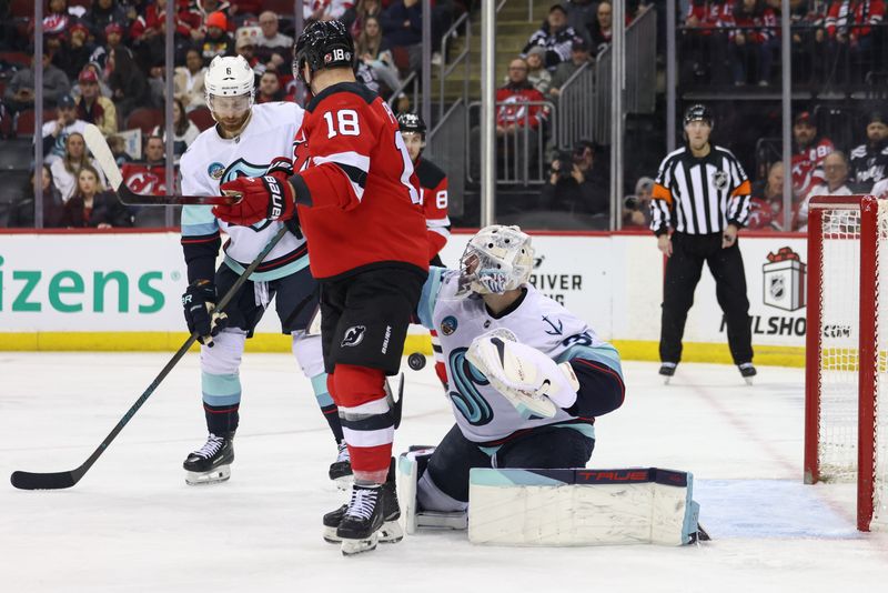 Dec 6, 2024; Newark, New Jersey, USA; Seattle Kraken goaltender Philipp Grubauer (31) makes a save against the New Jersey Devils during the second period at Prudential Center. Mandatory Credit: Ed Mulholland-Imagn Images