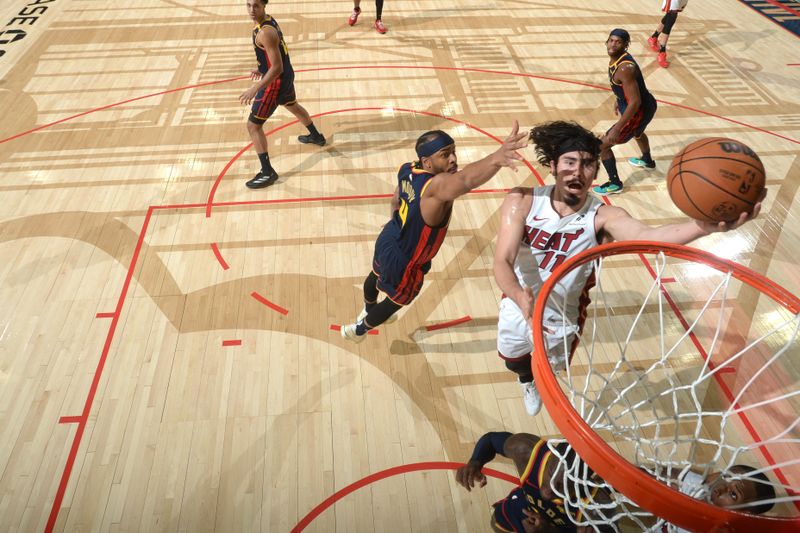 SAN FRANCISCO, CA - JANUARY 7: Jaime Jaquez Jr. #11 of the Miami Heat drives to the basket during the game against the Golden State Warriors on January 7, 2025 at Chase Center in San Francisco, California. NOTE TO USER: User expressly acknowledges and agrees that, by downloading and or using this photograph, user is consenting to the terms and conditions of Getty Images License Agreement. Mandatory Copyright Notice: Copyright 2025 NBAE (Photo by Noah Graham/NBAE via Getty Images)