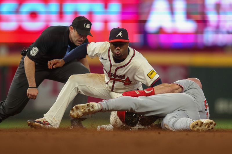 May 8, 2025; Atlanta, Georgia, USA; Atlanta Braves second baseman Ozzie Albies (1) tags out Cincinnati Reds outfielder Blake Dunn (59) on a steal attempt in the eleventh inning at Truist Park. Mandatory Credit: Brett Davis-Imagn Images
