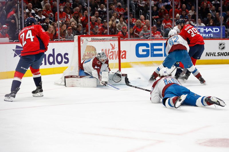 Feb 13, 2024; Washington, District of Columbia, USA; Washington Capitals center Connor McMichael (24) scores a goal on Colorado Avalanche goaltender Alexandar Georgiev (40) as Avalanche defenseman Samuel Girard (49) and Avalanche left wing Artturi Lehkonen (62) defend in the first period at Capital One Arena. Mandatory Credit: Geoff Burke-USA TODAY Sports