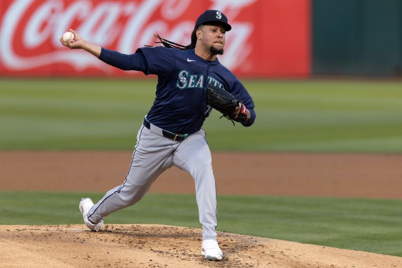 Sep 3, 2024; Oakland, California, USA; Seattle Mariners starting pitcher Luis Castillo (58) delivers a pitch against the Oakland Athletics during the first inning at Oakland-Alameda County Coliseum. Mandatory Credit: D. Ross Cameron-Imagn Images