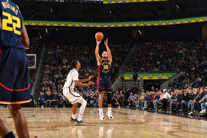 SAN FRANCISCO, CA - NOVEMBER 25: Stephen Curry #30 of the Golden State Warriors shoots a three point basket during the game against the Brooklyn Nets on November 25, 2024 at Chase Center in San Francisco, California. NOTE TO USER: User expressly acknowledges and agrees that, by downloading and or using this photograph, user is consenting to the terms and conditions of Getty Images License Agreement. Mandatory Copyright Notice: Copyright 2024 NBAE (Photo by Noah Graham/NBAE via Getty Images)