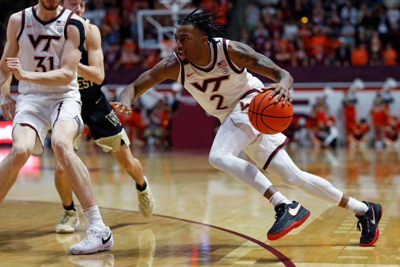 Mar 2, 2024; Blacksburg, Virginia, USA; Virginia Tech Hokies guard MJ Collins (2) drives to the basket against Wake Forest Demon Deacons guard Parker Friedrichsen (20) during the second half at Cassell Coliseum. Mandatory Credit: Peter Casey-USA TODAY Sports