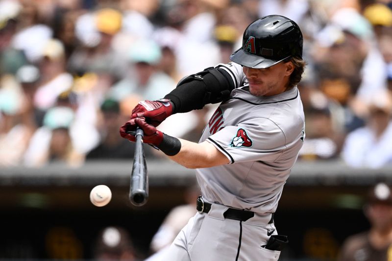 Jun 9, 2024; San Diego, California, USA; Arizona Diamondbacks right fielder Jake McCarthy (31) hits a single during the first inning against the San Diego Padres at Petco Park. Mandatory Credit: Denis Poroy-USA TODAY Sports at Petco Park. 