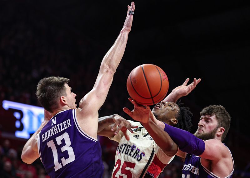 Feb 15, 2024; Piscataway, New Jersey, USA; Rutgers Scarlet Knights guard Jeremiah Williams (25) drives to the basket against Northwestern Wildcats guard Brooks Barnhizer (13) and center Matthew Nicholson (34) during the second half at Jersey Mike's Arena. Mandatory Credit: Vincent Carchietta-USA TODAY Sports