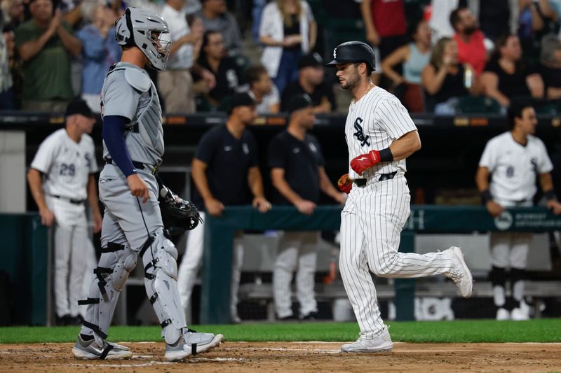 Aug 23, 2024; Chicago, Illinois, USA; Chicago White Sox outfielder Andrew Benintendi (23) scores against the Detroit Tigers during the fourth inning at Guaranteed Rate Field. Mandatory Credit: Kamil Krzaczynski-USA TODAY Sports