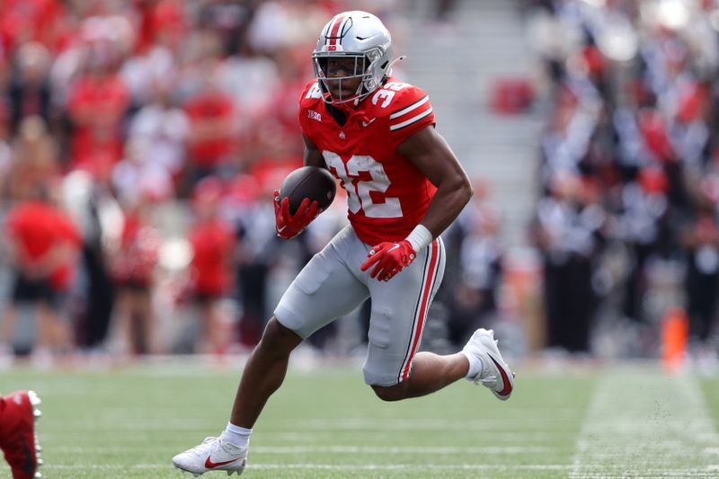 Sep 9, 2023; Columbus, Ohio, USA;  Ohio State Buckeyes running back TreVeyon Henderson (32) runs for the touchdown during the second half against the Youngstown State Penguins at Ohio Stadium. Mandatory Credit: Joseph Maiorana-USA TODAY Sports