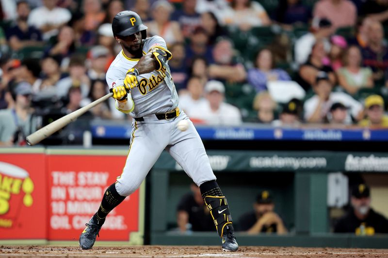Jul 31, 2024; Houston, Texas, USA; Pittsburgh Pirates designated hitter Andrew McCutchen (22) hits an RBI single against the Houston Astros during the second inning at Minute Maid Park. Mandatory Credit: Erik Williams-USA TODAY Sports