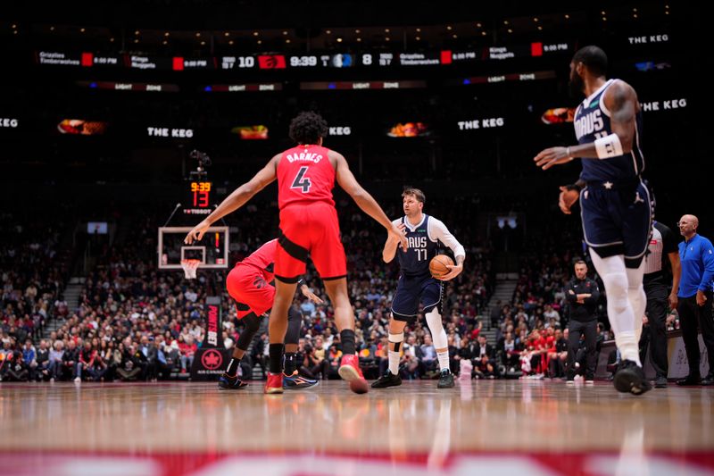 TORONTO, CANADA - FEBRUARY 28: Luka Doncic #77 of the Dallas Mavericks handles the ball during the game against the Toronto Raptors on February 28, 2024 at the Scotiabank Arena in Toronto, Ontario, Canada.  NOTE TO USER: User expressly acknowledges and agrees that, by downloading and or using this Photograph, user is consenting to the terms and conditions of the Getty Images License Agreement.  Mandatory Copyright Notice: Copyright 2024 NBAE (Photo by Mark Blinch/NBAE via Getty Images)