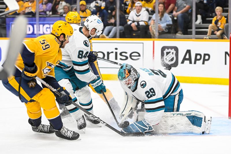 Oct 21, 2023; Nashville, Tennessee, USA; San Jose Sharks goaltender Mackenzie Blackwood (29) blocks the shot of Nashville Predators defenseman Roman Josi (59) during the first period at Bridgestone Arena. Mandatory Credit: Steve Roberts-USA TODAY Sports