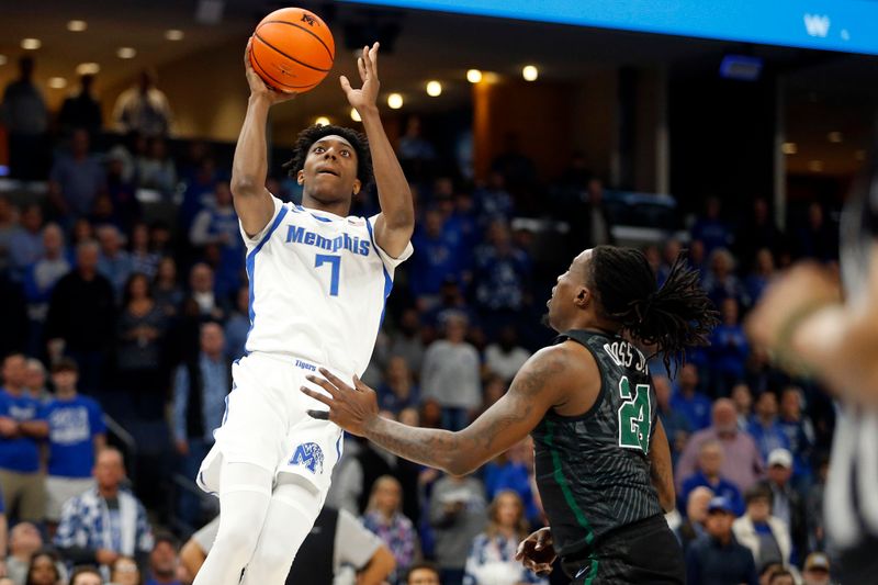 Feb 11, 2024; Memphis, Tennessee, USA; Memphis Tigers forward Nae'Qwan Tomlin (7) shoots as Tulane Green Wave forward Kevin Cross (24) defends during the first half at FedExForum. Mandatory Credit: Petre Thomas-USA TODAY Sports