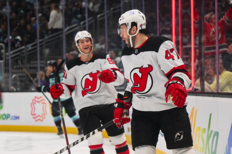 Jan 6, 2025; Seattle, Washington, USA; New Jersey Devils center Paul Cotter (47) reacts to scoring a goal against the Seattle Kraken during the second period at Climate Pledge Arena. Mandatory Credit: Steven Bisig-Imagn Images