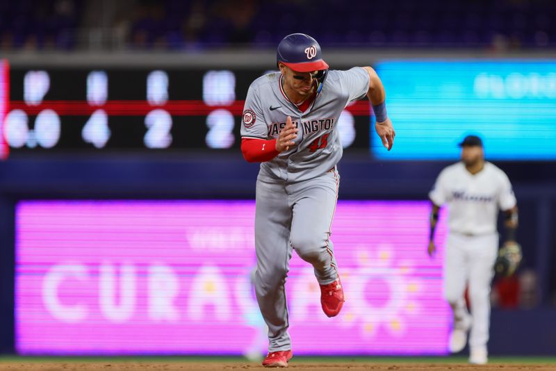 Apr 29, 2024; Miami, Florida, USA; Washington Nationals first baseman Joey Meneses (45) runs toward home plate after an RBI single by second baseman Ildemaro Vargas (not pictured) during the seventh inning at loanDepot Park. Mandatory Credit: Sam Navarro-USA TODAY Sports