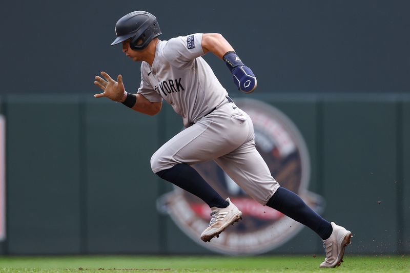 May 16, 2024; Minneapolis, Minnesota, USA; New York Yankees Anthony Volpe (11) steals second base against the Minnesota Twins during the second inning at Target Field. Mandatory Credit: Matt Krohn-USA TODAY Sports