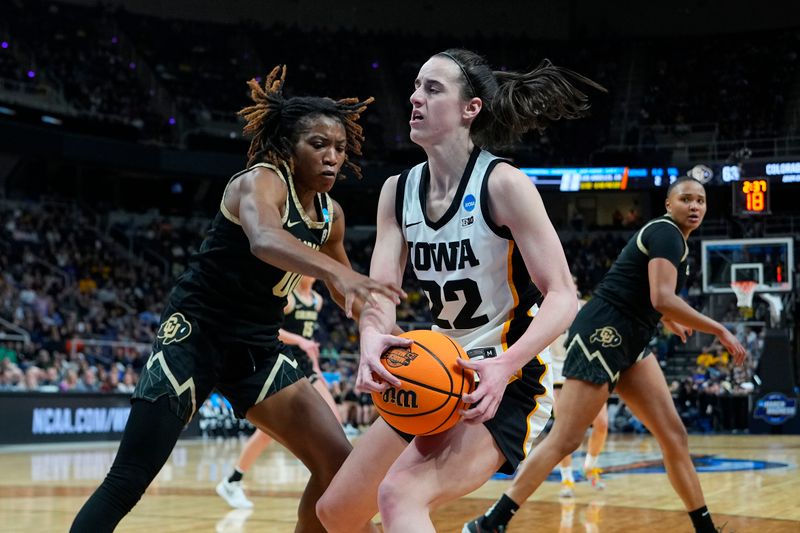 Mar 30, 2024; Albany, NY, USA; Iowa Hawkeyes guard Caitlin Clark (22) dribbles the ball against Colorado Buffaloes guard Jaylyn Sherrod (0) in the semifinals of the Albany Regional of the 2024 NCAA Tournament at the MVP Arena. Mandatory Credit: Gregory Fisher-USA TODAY Sports