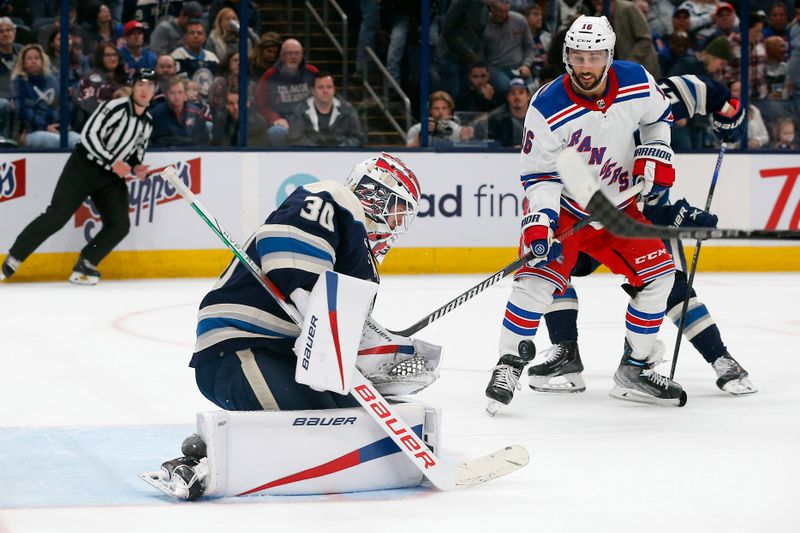 Oct 14, 2023; Columbus, Ohio, USA; Columbus Blue Jackets goalie Spencer Martin (30) makes a save as New York Rangers center Vincent Trocheck (16) looks for a rebound during the third period at Nationwide Arena. Mandatory Credit: Russell LaBounty-USA TODAY Sports