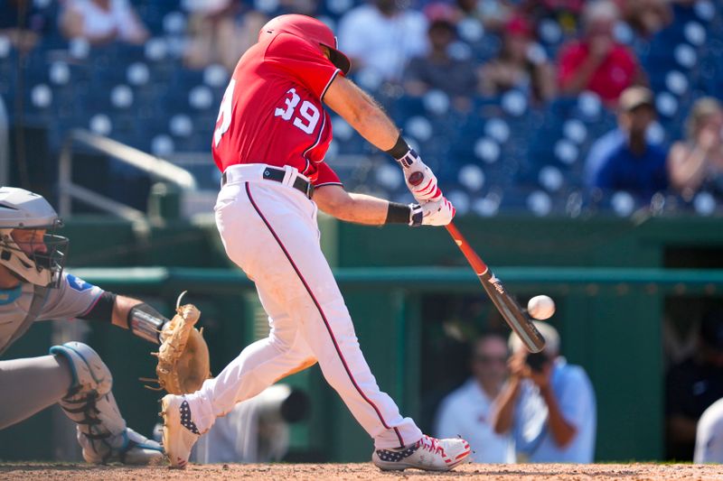 Sep 3, 2023; Washington, District of Columbia, USA;  Washington Nationals second baseman Jake Alu (39) hits a single against the Miami Marlins during the sixth inning at Nationals Park. Mandatory Credit: Gregory Fisher-USA TODAY Sports