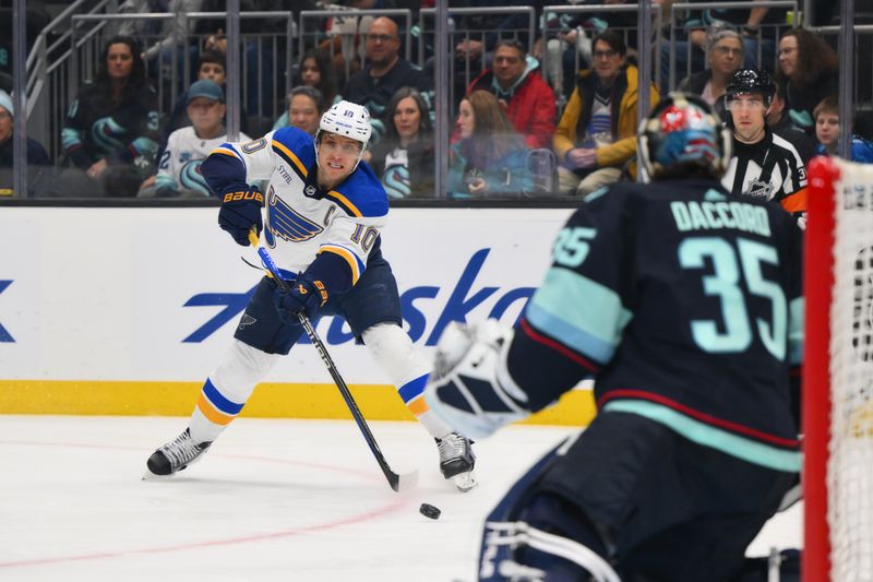 Jan 26, 2024; Seattle, Washington, USA; St. Louis Blues center Brayden Schenn (10) passes the puck against the Seattle Kraken during the first period at Climate Pledge Arena. Mandatory Credit: Steven Bisig-USA TODAY Sports