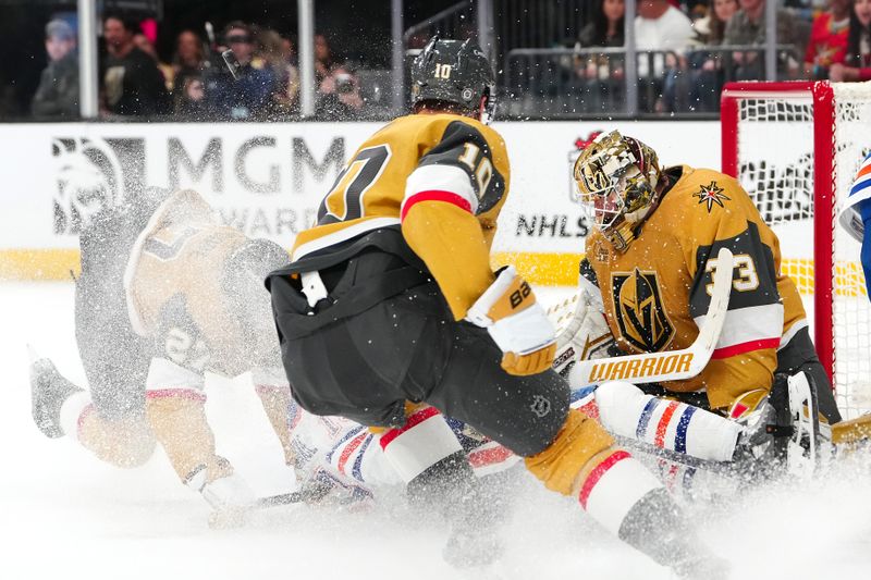 Dec 3, 2024; Las Vegas, Nevada, USA; Vegas Golden Knights goaltender Adin Hill (33) makes a save against the Edmonton Oilers during the third period at T-Mobile Arena. Mandatory Credit: Stephen R. Sylvanie-Imagn Images