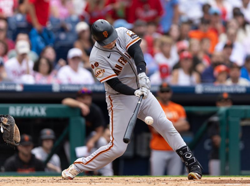 Aug 23, 2023; Philadelphia, Pennsylvania, USA; San Francisco Giants first baseman Wilmer Flores (41) hits an RBI single during the third inning against the Philadelphia Phillies at Citizens Bank Park. Mandatory Credit: Bill Streicher-USA TODAY Sports