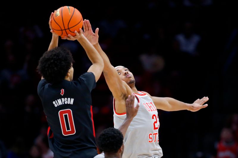 Jan 3, 2024; Columbus, Ohio, USA; Rutgers Scarlet Knights guard Derek Simpson (0) shoots the ball as Ohio State Buckeyes forward Zed Key (23) defends during the second half at Value City Arena. Mandatory Credit: Joseph Maiorana-USA TODAY Sports
