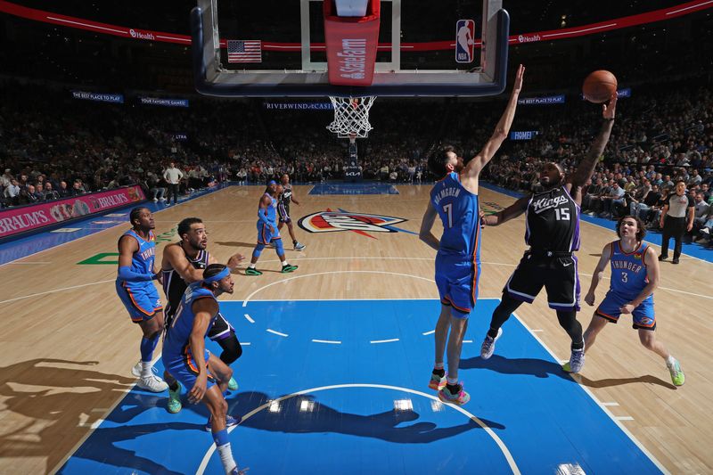 OKLAHOMA CITY, OK - APRIL 9:  Davion Mitchell #15 of the Sacramento Kings shoots the ball during the game against the Oklahoma City Thunder on April 9, 2024 at Paycom Arena in Oklahoma City, Oklahoma. NOTE TO USER: User expressly acknowledges and agrees that, by downloading and or using this photograph, User is consenting to the terms and conditions of the Getty Images License Agreement. Mandatory Copyright Notice: Copyright 2024 NBAE (Photo by Zach Beeker/NBAE via Getty Images)