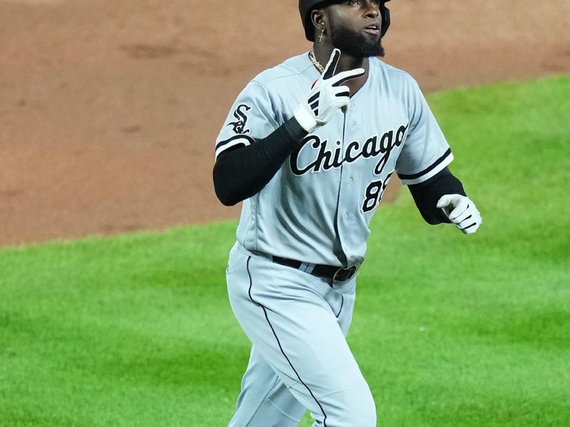 Aug 19, 2023; Denver, Colorado, USA; Chicago White Sox center fielder Luis Robert Jr. (88) celebrates his solo home run in the eighth inning against the Colorado Rockies at Coors Field. Mandatory Credit: Ron Chenoy-USA TODAY Sports